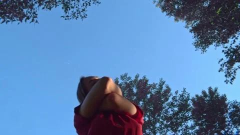 Girl dancing in the forest, park  in red dress Stock Footage
