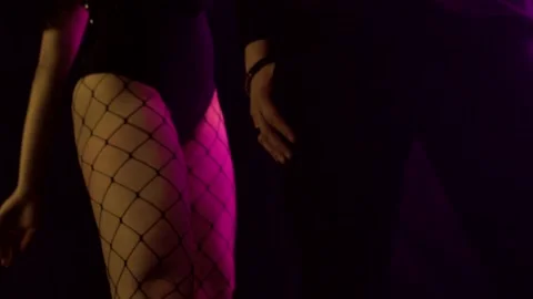 A girl is dancing in front of a guy. Beautiful dance in front of a guy. brutal Stock Footage 132919988