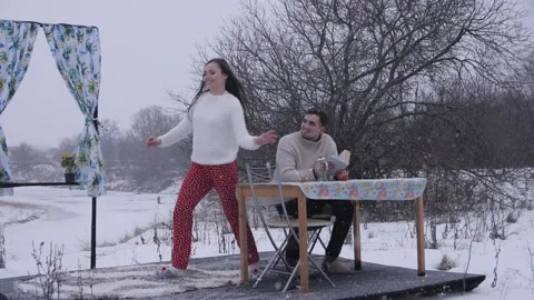 Girl Dancing in Front of a Guy in the Winter on Stage Stock Footage 144637033
