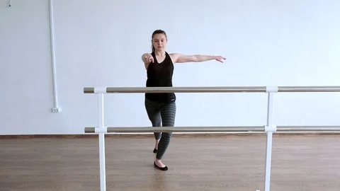 Girl dancing in a large bright Studio. Dancer training Stock Footage 122561778