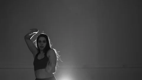 Girl dancing modern dance on gray background, strip dance, vogue, isolated 库存影片 107439420