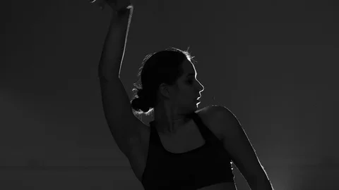 Girl dancing modern dance on gray background, strip dance, vogue, isolated 库存影片 107439443