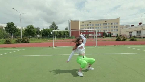 Girl dancing modern dance in the open air. Booty Dance. Slow motion. Gimbal shot Stock Footage 133372093