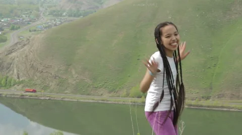 Girl dancing on a mountain Stock Footage 62915981