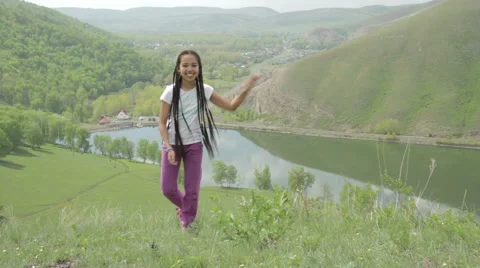 Girl dancing on a mountain Stock Footage 62916709