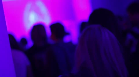 Girl dancing in night club drinking alcohol beer from bottle, click for HD Stock Footage