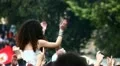Girl dancing over the shoulders at rock concert HD Footage