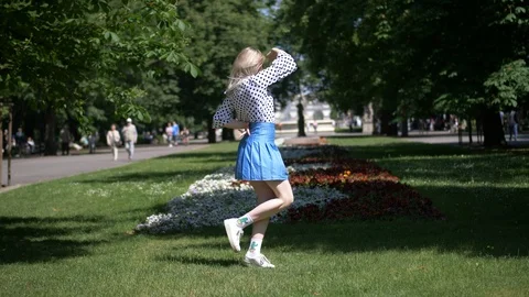 Girl Dancing in a Park Stock Footage