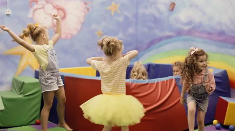 Girl dancing in the playroom Stock Footage 64347239