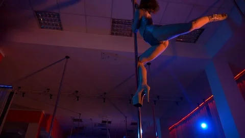 Girl dancing on a pylon. Striptease danc... | Stock Video | Pond5