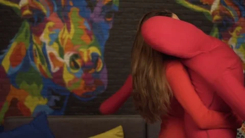 The girl is dancing a slow dance with a large, soft dummy. Slow motion. In the Stock Footage 71487784