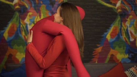 The girl is dancing a slow dance with a large, soft dummy. Slow motion. In the Stock Footage 71490325