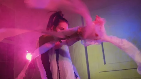 Girl dancing in studio with pink light. Video stock 100837483