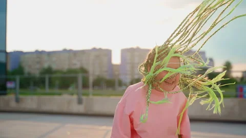 Girl dancing on sunset outdoors close up Stock Footage 202219085