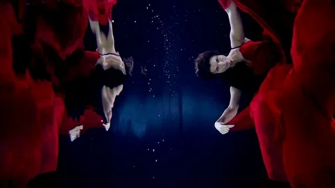 Girl dancing under water in the cloud that red dress Video stock 73790713
