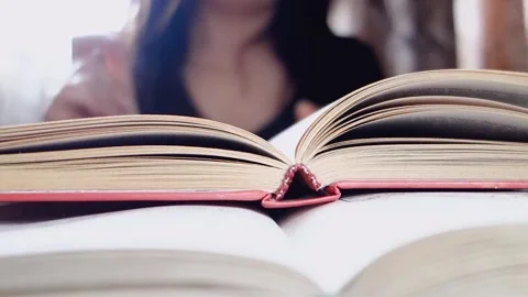 Girl dancing while reading books. Video stock 103194674