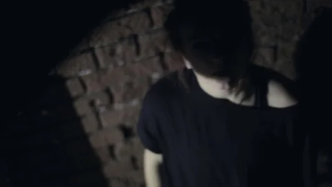 Girl in the dark close-up 스톡 동영상 76508232