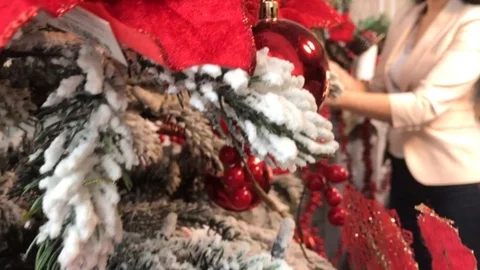 Girl decorates a christmas tree Stock Footage