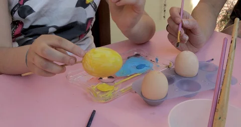 Girl decorating Easter eggs Stock Footage 128151277
