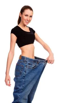 Girl demonstrating weight loss Stock Photos