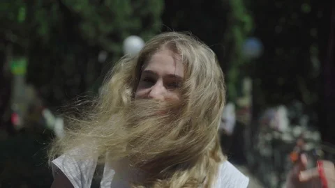 Girl develops hair in the wind Stock Footage 111216140