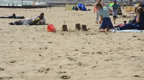 Girl digging on beach Stock Footage 45911719