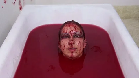 Girl Dives and comes up from a Bath of Blood Stock Footage