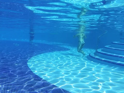 Girl diving in the pool Stock Footage 105101423