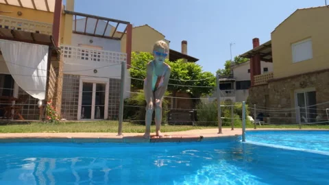 Girl diving into pool 動画素材 274900943