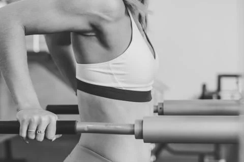 The girl does exercises on simulators Stock Photos