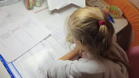 Girl does lessons Stock Footage 145448193