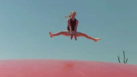 A Girl does the Splits while Jumping Slow Motion Video stock 344656206