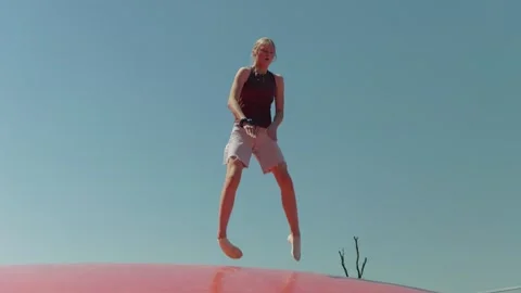 Girl does the Splits while Jumping Slow Motion Video stock 345595734