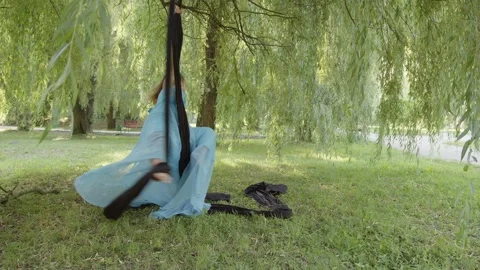 Girl does the splits while she holding aerial silk Video stock 157970628