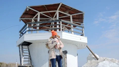 The girl with the dog on the background of the lighthouse. Stock Footage 74912780