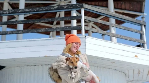 The girl with the dog on the background of the lighthouse. 動画素材 74913085