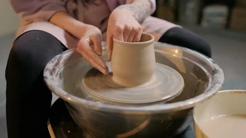 The girl doing ceramic. Clay work. Pottery wheel. Close-up. Stock Footage 169709537