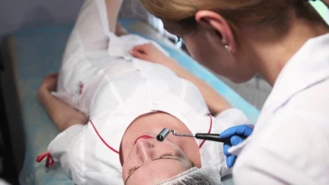 The girl doing cosmetic procedures in spa clinic Stock Footage