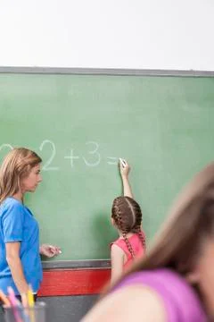 Girl doing an excercise of math Fotos Stock