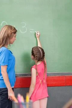 Girl doing an excercise of math Stock Photos