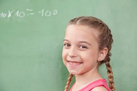 Girl doing an excercise of math Stock Photos