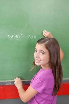 Girl doing an excercise of math Stock Photos