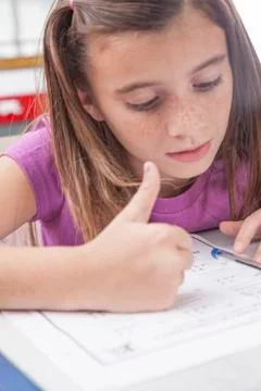 Girl doing the exercise of math Stock Photos