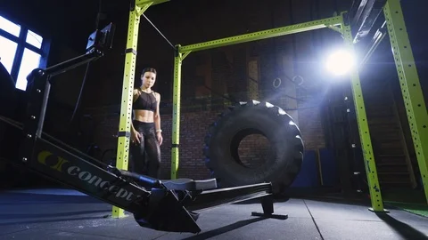 Girl doing exercise on rowing machine Stock Footage 123077705