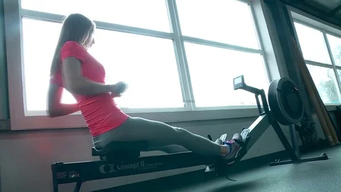 The girl is doing the exercise on training apparatus Stock Footage 79159883