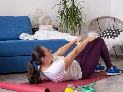 Girl doing exercises at home Stock Photos