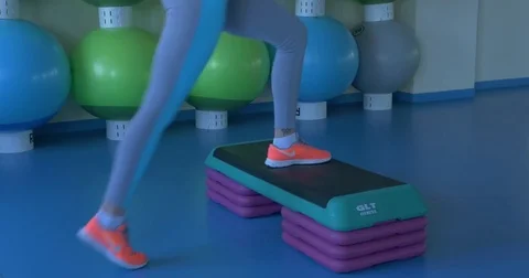 Girl doing exercises for legs in the fitness room. Girls do exercises on morning Stock Footage