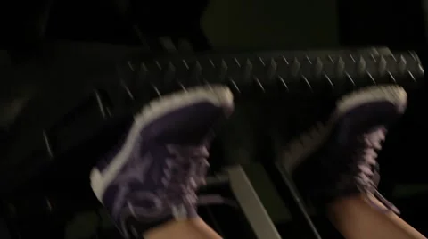 Girl doing exercises for legs on the simulator Stock Footage 56343900