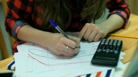 Girl doing exercises on math and smiling to the camera, steadycam shot Video stock 59993203