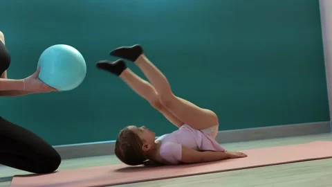Girl doing flexibility stretch with stability ball Video stock 327715978